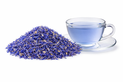 Blue Cornflower Tea brewed in glass cup with dried blue cornflower petals